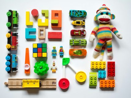 A white background with toys assorted into tidy rows.